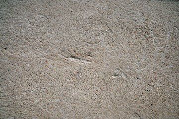 Rough beige stone texture close-up