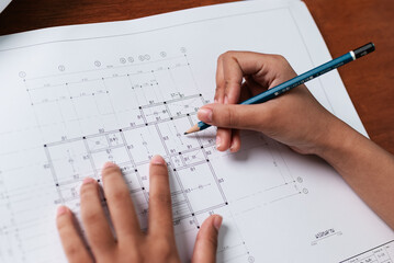 Architectural planning process design studio blueprint creation indoor workspace close-up view creativity unleashed