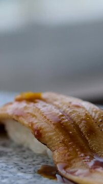 4K fottage. Place the conger eel nigiri sushi on the counter. High quality 