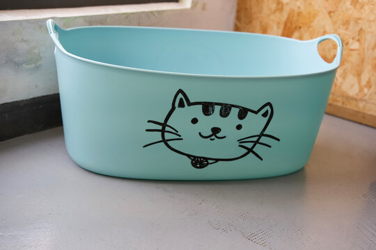 Cute blue storage basket with cat face design, perfect for organizing toys or household items in stylish way