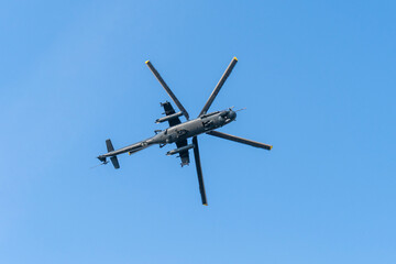 Soviet-made black old military helicopter flying in the sky in Budapest