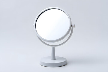 Fototapeta premium Minimal white vanity mirror on round base with soft shadows. Great for beauty branding, skincare product mockups, or modern interior visuals. Simple, elegant, and functional.