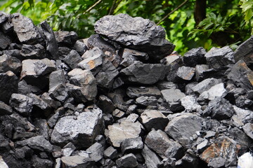 Natural wood charcoal piled up on the ground