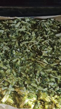 Delicious Homemade cheesy spinach quiche pie. spinach pie making process
