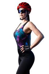 A young female cyclist wearing a safety helmet and glasses, dressed in a bib shorts poses against a black background in the studio.