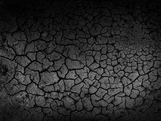 Dark and Cracked Earth Surface Highlighting Texture and Pattern