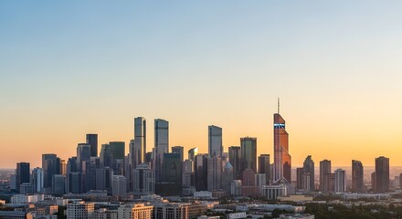 Obraz premium Modern City Skyline at Sunset with Tall Buildings and Clear Sky 