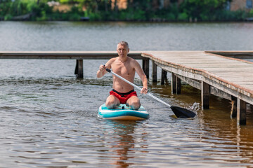 A man masters a SUP board.