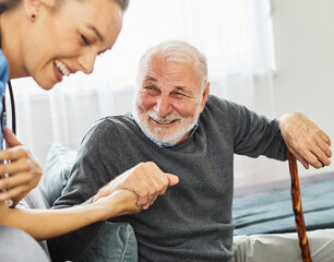 Doctor or nurse caregiver with senior man holding walking cane at home or nursing home