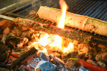 Adana kebap on the grill