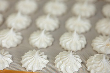Meringue cookie on silicone mat 