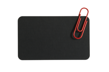Red paperclip attached to black card isolated on transparent background