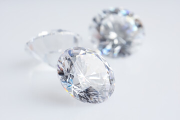 Many shiny diamonds on light background, closeup