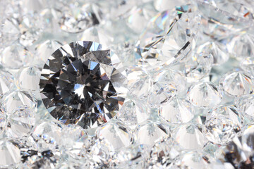 Many shiny diamonds on light background, closeup