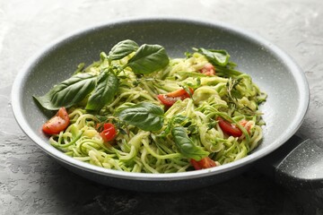 Tasty zucchini noodles with tomatoes and basil