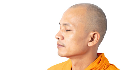 Obraz premium A Buddhist monk in orange robes, meditating peacefully with eyes closed