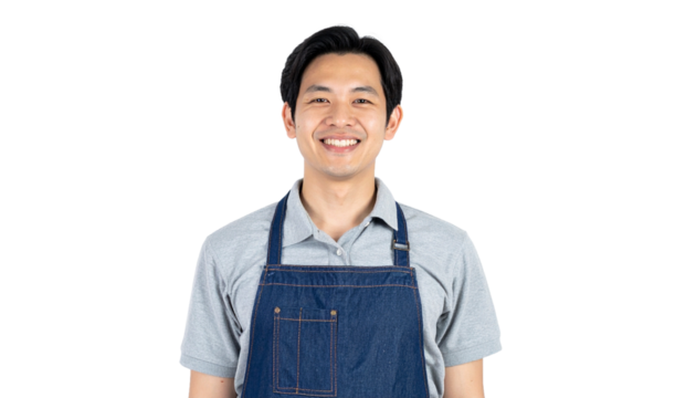 A smiling individual wearing an apron, ready for service