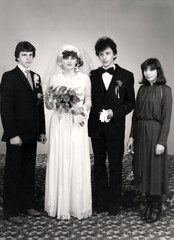 Slovakia - circa 1979: Bride and groom and their best men on their wedding day.
