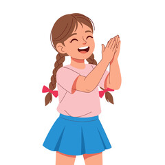 A young girl with braided hair, wearing a pink shirt and blue skirt, is clapping her hands and smiling happily.