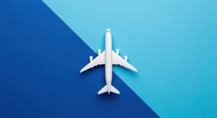 White Airplane Model Against Blue Background