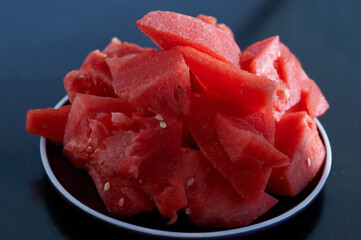 red slices of watermelon on a glass plate