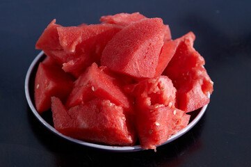 red slices of watermelon on a glass plate