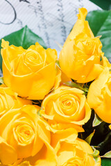 A luxurious bouquet of yellow roses. Bunch of many colorful fragrant flowers. Floristry and floral design concept. Floral texture. Vertical