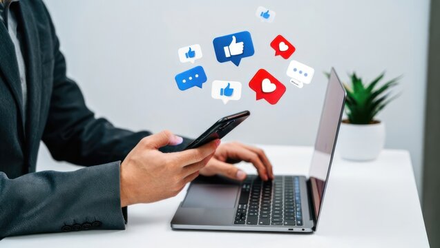 Businessman interacting with social media icons on phone and laptop