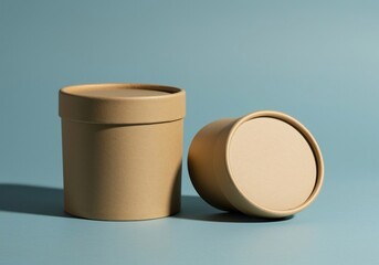 Elegant Cardboard Packaging Mockup: Two Cylindrical Containers on a Subtle Blue Background
