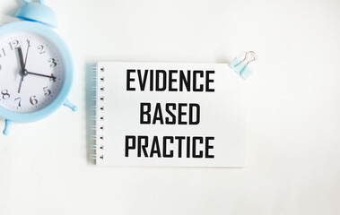 SCIENTIFICALLY BASED PRACTICE text on a notebook .A text with evidence-based public health at its disposal
