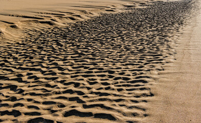 Beach waves leaving their mark in the sand