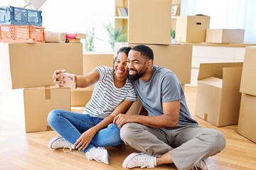 Portrait of a young couple unpacking, moving in and relocation to a new apartment, happy young...
