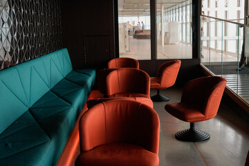 Modern Lounge Area with Vibrant Seating and Sophisticated Design Elements