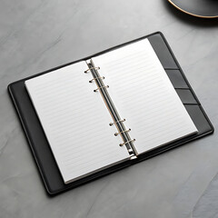 Black leather binder open with lined pages image