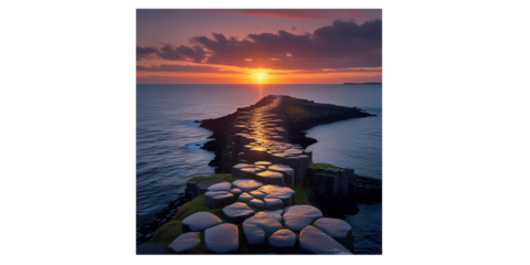A captivating coastal scene at sunset where a rocky path extends into the ocean.