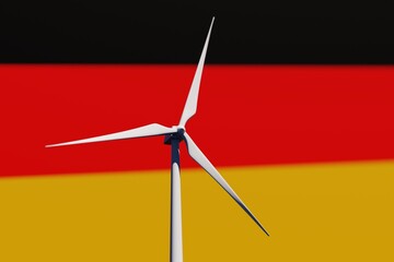 Wind turbine on a background of blurred flag of Germany. Wind power concept, selective focus © Hairem