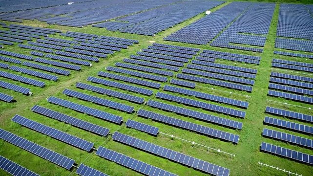 Aerial view of a vast solar panel farm generating clean energy