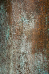 Close-up view reveals the intricate surface texture of verdigris tin exhibiting natural metallic wear, highlighting unique patterns and color variations in the material.