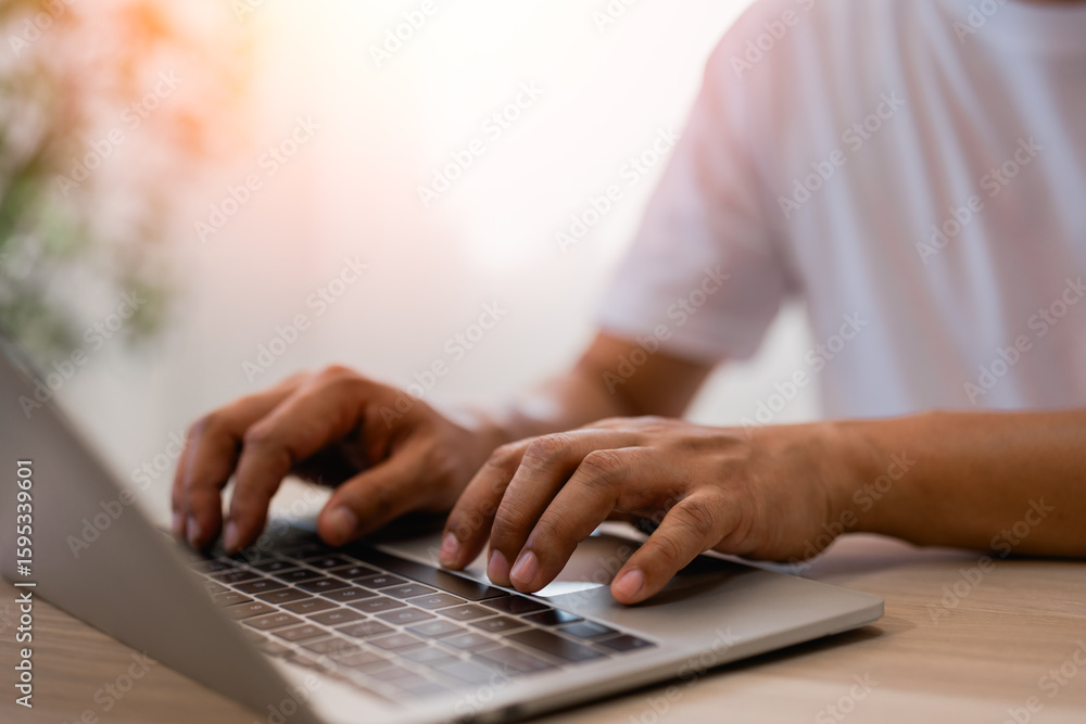 Poster close-up a hands man typing keyboard of laptop computer communicates on internet technology on offic