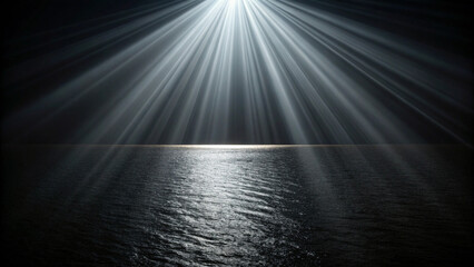 Dramatic sunlight rays piercing through clouds over a calm ocean at twilight