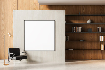 Modern interior with empty poster frame on minimalist wall surrounded by wooden panels, black chair, lamp, and bookshelf in elegant layout. 3D Rendering