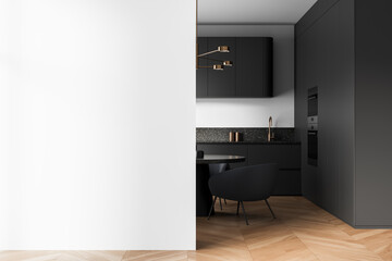 Modern kitchen interior with clean blank white wall and stylish dark cabinetry, ideal for poster...