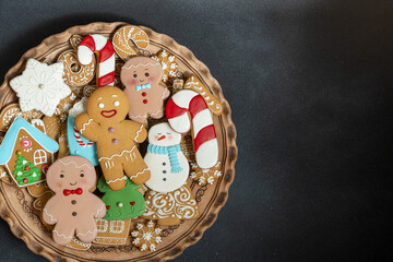 Gingerbread cookies with icing decoration. Christmas dessert food. Gingerbread man baking. Xmas...
