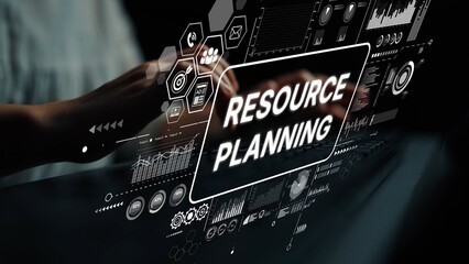 Hands Engaging with Digital Interface for Resource Planning and Management in Modern Business...