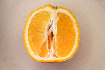 Photo of juicy halved orange. Citrus fruit macro photo
