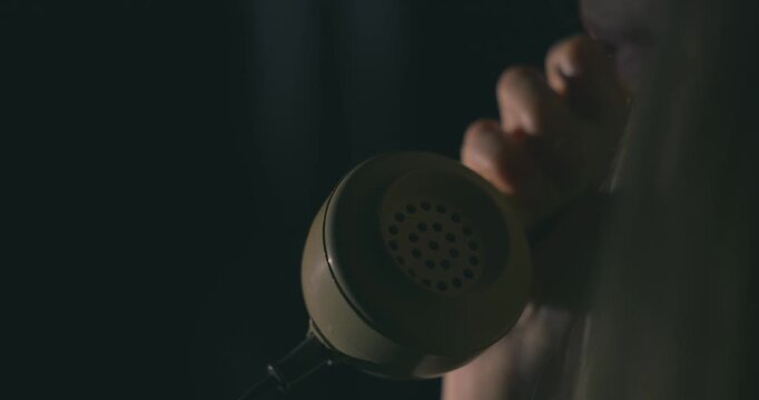 Making a call on an old rotary telephone