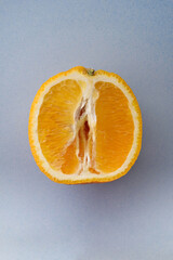 Photo of juicy halved orange. Citrus fruit macro photo