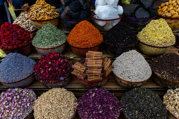 Vibrant Spices and Dried Flowers in a Traditional Market