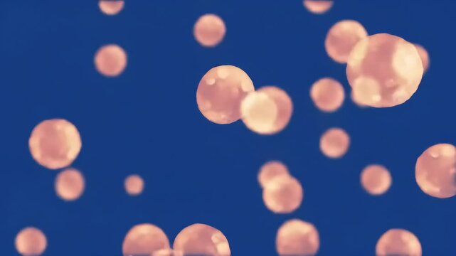 Orange bubbles float, blue backdrop, bokeh