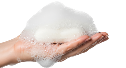 A person holding a soap bar covered in white foam bubbles in their hand on a black background image